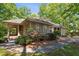 Charming house with well-maintained landscaping, dormer windows, and a welcoming entrance at 11470 Club Dr, Chapel Hill, NC 27517