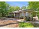 Charming house with well-maintained landscaping, dormer windows, and a welcoming entrance at 11470 Club Dr, Chapel Hill, NC 27517