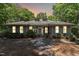 Welcoming home featuring dormer windows, lush greenery, and a stone walkway, perfect for peaceful living at 11470 Club Dr, Chapel Hill, NC 27517