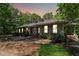 Charming single story home with mature landscaping and a beautiful walkway leading to the front entrance at 11470 Club Dr, Chapel Hill, NC 27517