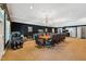 Spacious game room with large conference table, massage chair, and dark blue accent wall at 11470 Club Dr, Chapel Hill, NC 27517