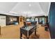 Large game room with foosball table, conference table, and massage chair at 11470 Club Dr, Chapel Hill, NC 27517