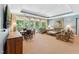 Bright and spacious living area boasting large windows, comfortable seating, and a balcony at 11470 Club Dr, Chapel Hill, NC 27517