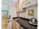 A charming kitchenette space features a sink, microwave, cabinetry, and a mini-fridge at 11470 Club Dr, Chapel Hill, NC 27517