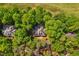 Scenic aerial view of neighborhood homes surrounded by lush greenery, creating a private and tranquil setting at 11475 Club Dr, Chapel Hill, NC 27517