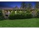 Expansive backyard view showcasing a covered porch and mature trees at 11475 Club Dr, Chapel Hill, NC 27517