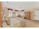 Bedroom features two twin beds, large windows, a ceiling fan, and an armoire at 11475 Club Dr, Chapel Hill, NC 27517
