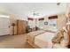Comfortable bedroom featuring two beds, large windows, and a ceiling fan and lamp at 11475 Club Dr, Chapel Hill, NC 27517