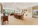 Spacious dining area with a large table, built-in shelving, and access to the living room at 11475 Club Dr, Chapel Hill, NC 27517