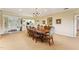Elegant dining room open to kitchen, featuring a large table and ample natural light at 11475 Club Dr, Chapel Hill, NC 27517