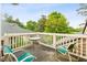 Inviting outdoor balcony featuring seating and a table, perfect for relaxing and enjoying the surrounding view at 11477 Club Dr, Chapel Hill, NC 27517