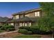 Twilight view of home with two stories, green roofing, manicured lawn, and stone walkway at 11477 Club Dr, Chapel Hill, NC 27517