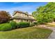 Well-maintained home with manicured landscaping and lush greenery at 11477 Club Dr, Chapel Hill, NC 27517