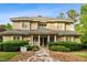 Charming two-story home with a stone walkway and lush landscaping at 11477 Club Dr, Chapel Hill, NC 27517