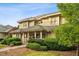 Beautiful two-story home with well-kept landscaping and a stone pathway leading to the entrance at 11477 Club Dr, Chapel Hill, NC 27517
