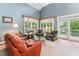 Spacious living room featuring vaulted ceilings and access to a porch at 11477 Club Dr, Chapel Hill, NC 27517
