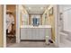 Well-lit bathroom featuring double vanity, large mirror, and ample storage at 11483 Club Dr, Chapel Hill, NC 27517