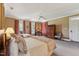 Bright bedroom with carpeted floors, large windows and two beds that create a cozy and relaxing atmosphere at 11483 Club Dr, Chapel Hill, NC 27517
