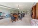 Large entertainment room with a long conference table, TV, and comfortable seating area at 11483 Club Dr, Chapel Hill, NC 27517