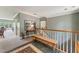 Spacious hallway with a bench, staircase, and decorative rug at 11483 Club Dr, Chapel Hill, NC 27517