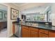 This kitchen boasts stainless steel appliances and beautiful wooden cabinets, perfect for your culinary adventures at 11483 Club Dr, Chapel Hill, NC 27517