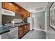 Functional kitchen with wood cabinets, stainless steel sink, and essential appliances at 11483 Club Dr, Chapel Hill, NC 27517