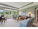 Inviting living room with views of nature, featuring comfortable seating, and a bright, airy atmosphere at 11483 Club Dr, Chapel Hill, NC 27517