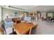 Expansive living area featuring a kitchen bar, dining space, and comfortable seating, perfect for entertaining and relaxing at 11483 Club Dr, Chapel Hill, NC 27517