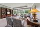 Spacious living room with tray ceilings, recessed lighting, built-in bookshelves and views of the outdoor landscape at 11483 Club Dr, Chapel Hill, NC 27517