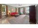 Inviting living room features large windows, carpeted floors, and comfortable seating at 11483 Club Dr, Chapel Hill, NC 27517