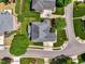 This aerial view showcases the house's landscaping, roof, and yard within the neighborhood at 11916 Deneb Ct, Raleigh, NC 27614