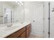 Bathroom featuring a double vanity, a large mirror, and tile floors at 11916 Deneb Ct, Raleigh, NC 27614