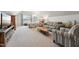 Expansive room with a comfortable seating area, bed, soft carpet, and natural light at 11916 Deneb Ct, Raleigh, NC 27614