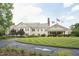 Beautiful clubhouse with manicured lawn and flags on a sunny day at 11916 Deneb Ct, Raleigh, NC 27614