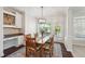 Lovely dining room with wooden furniture and natural light with a view to the outdoor at 11916 Deneb Ct, Raleigh, NC 27614