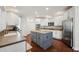 This spacious kitchen boasts stainless steel appliances and a central island, perfect for entertaining at 11916 Deneb Ct, Raleigh, NC 27614