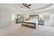 This primary bedroom features a tray ceiling and generous space for a serene retreat at 11916 Deneb Ct, Raleigh, NC 27614