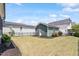 A large, well-maintained backyard featuring a shed at 12 Beacon Ridge Blvd, Chapel Hill, NC 27516