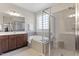 Modern bathroom featuring a glass shower, soaking tub, and double vanity at 12 Beacon Ridge Blvd, Chapel Hill, NC 27516