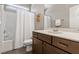 Bathroom featuring a vanity with cabinets and a shower-tub combo at 12 Beacon Ridge Blvd, Chapel Hill, NC 27516