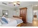 Bedroom with hardwood floors, closet, and wooden cabinet at 12 Beacon Ridge Blvd, Chapel Hill, NC 27516