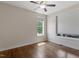 Empty bedroom with hardwood floors and two windows providing lots of natural light at 12 Beacon Ridge Blvd, Chapel Hill, NC 27516