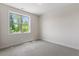 Cozy bedroom with plush carpeting and a sunlit window at 12 Beacon Ridge Blvd, Chapel Hill, NC 27516