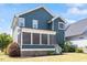 Beautiful two-story home featuring a screened porch and manicured lawn at 12 Beacon Ridge Blvd, Chapel Hill, NC 27516