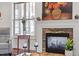Stone fireplace with mantle and artwork in the living room at 12 Beacon Ridge Blvd, Chapel Hill, NC 27516