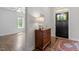 Bright foyer with hardwood floors, a decorative rug, and view to a bedroom at 12 Beacon Ridge Blvd, Chapel Hill, NC 27516