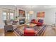 Cozy living room with fireplace, artwork, windows, and hardwood floors at 12 Beacon Ridge Blvd, Chapel Hill, NC 27516