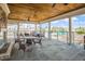 Outdoor patio featuring stone floors, a fireplace, metal railings, and lots of seating with great views of the outdoors at 12 Beacon Ridge Blvd, Chapel Hill, NC 27516