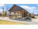Covered pavilion featuring stone pillars, picnic tables, grills, and nearby homes for convenient outdoor gatherings at 12 Beacon Ridge Blvd, Chapel Hill, NC 27516