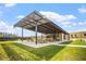 Picnic area featuring modern metal shade, lots of tables, grill, and a grassy area offers a great outdoor experience at 12 Beacon Ridge Blvd, Chapel Hill, NC 27516